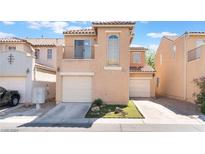 Charming two-story townhome with a private balcony, attached garage and well-maintained landscaping at 6270 Dartington Hall St, Henderson, NV 89011