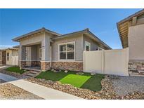 Charming single-story home features stucco siding, brick accents, neat landscaping and a cozy covered front porch entry at 759 Praire Plume St, Henderson, NV 89011