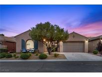 Charming single-story home with desert landscaping and a two-car garage, perfect for comfortable living at 940 Viscanio Pl, Las Vegas, NV 89138