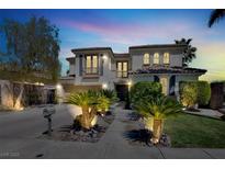 Elegant two-story home with manicured front yard and inviting curb appeal in a peaceful neighborhood at , Las Vegas, NV 89135