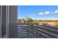 Balcony overlooking street with desert and mountain views in the background at 1163 Blossom Point St, Las Vegas, NV 89135