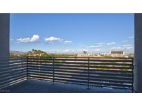 Enjoy the stunning city view from this private balcony with horizontal metal railings at 1187 Blossom Point St # 36, Las Vegas, NV 89135