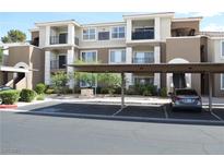 Beautiful condo building with covered parking and well-maintained landscaping at 2900 Sunridge Heights Pkwy # 1733, Henderson, NV 89052