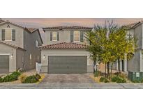 Charming two-story home featuring a well-maintained front yard and a two-car garage at 6848 Calvitero St, Las Vegas, NV 89149