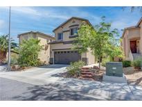 Charming two-story home showcasing a well-maintained front yard and a two-car garage on a sunny day at 9844 Red Horse St, Las Vegas, NV 89143