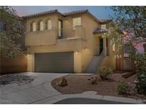 Inviting two-story home with a cozy balcony and a convenient two-car garage at 11247 Villa Trentino Ct, Las Vegas, NV 89141