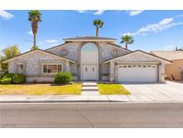 Stunning single-Gathering home with well-manicured landscaping and a welcoming two-car garage at 313 Firestone Dr, Las Vegas, NV 89145