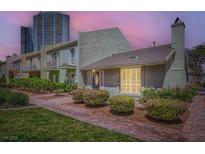 Charming single-Gathering home with brick walkway and manicured landscaping at 590 Tam O Shanter, Las Vegas, NV 89109