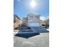 Charming two-story home with a well-maintained yard and a two-car garage at 8788 Elise Ct, Henderson, NV 89074