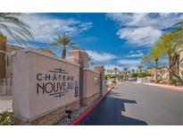 Inviting gated community entrance sign with beautifully landscaped surroundings and clear blue skies at 10001 Peace Way # 1341, Las Vegas, NV 89147