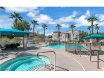 Community pool and spa area offers residents a refreshing and relaxing retreat in a beautifully landscaped setting at 10001 Peace Way # 1341, Las Vegas, NV 89147
