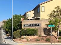 View of the Stoneridge community entrance with lush landscaping and well-maintained surroundings at 10756 Little Horse Creek Ave, Las Vegas, NV 89129