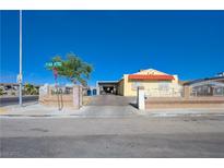 Charming single-story home featuring a well-manicured front yard and a welcoming front entrance at 2832 Geist Cir, Las Vegas, NV 89115