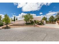 Charming single-story home featuring desert landscaping, a circular driveway, and an attached two-car garage at 4765 N Grand Canyon Dr, Las Vegas, NV 89129