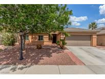 Charming single-story home featuring a well-maintained yard, mature tree, and a two-car garage at 5588 La Sendas Ct, Las Vegas, NV 89122