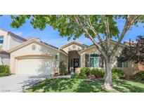 Charming single-story home featuring desert landscaping and a welcoming front entrance at 5844 Gushing Spring Ave, Las Vegas, NV 89131