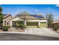 Charming single-story home featuring a two-car garage and solar panels for energy efficiency at 916 Bob Barney Ave, North Las Vegas, NV 89086