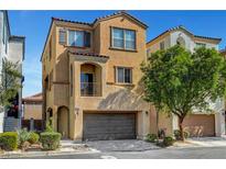 Beautiful two-story home featuring a balcony, attached two car garage and manicured landscaping at 9526 Summer Furnace St, Las Vegas, NV 89178