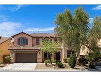 Charming two-story home featuring a two-car garage and low maintenance landscaping at 10281 Wolves Den Ln, Las Vegas, NV 89178