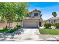 Charming two-story home featuring a two-car garage, landscaped yard, and a classic desert design at 1861 Windward Ct, Henderson, NV 89012