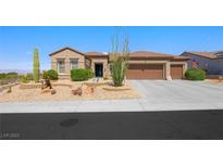 Charming single story home featuring desert landscaping, a three car garage, and a tile roof at 2962 Gettysburg Ave, Henderson, NV 89052