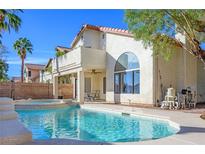 Beautiful backyard pool featuring a built-in spa, tanning ledge, and ample space for outdoor relaxation and entertainment at 3000 Waterview Dr, Las Vegas, NV 89117