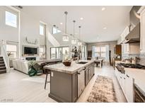 Spacious, modern kitchen with stainless steel appliances and a large center island for cooking and entertaining at 421 Malpaso St, Las Vegas, NV 89138