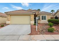 Charming single-story home with a well-maintained front yard and two car garage at 5965 Sierra Medina Ave, Las Vegas, NV 89139