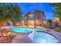 Stunning backyard with a large pool and spa, perfect for outdoor entertaining at 8204 Antler Pines Ct, Las Vegas, NV 89149
