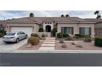 Charming single-story home featuring a well-manicured front yard and a two-car garage at 10023 Liberty View Rd, Las Vegas, NV 89148
