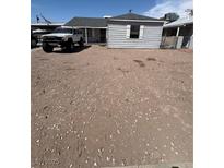 Cozy single-story home with a gravel front yard and ample parking space for multiple vehicles or recreational equipment at 102 Fir St, Henderson, NV 89015
