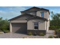 Charming two-story home with a neutral color palette, attached garage, and well-maintained landscaping at 117 Tardando Ave, Henderson, NV 89015
