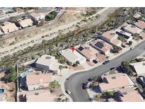 An aerial view shows the property's location in a well-maintained community with mature landscaping and nearby waterway at 1768 Saint Thomas Dr, Henderson, NV 89074