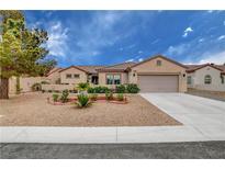 Charming single-story home features a low maintenance yard, desert landscaping, and a two car garage at 2092 Wildwood Lake Street, Henderson, NV 89052