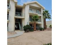 Charming two-story condo with desert landscaping and lovely balconies, providing a serene outdoor retreat at 3550 Bay Sands Dr # 2063, Laughlin, NV 89029