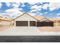 Charming single-story home featuring a two-car garage and a well-maintained front yard in a sunny neighborhood at 3630 Daisy Field Dr, North Las Vegas, NV 89032