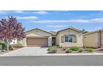 Inviting single-story home with a two-car garage, desert landscaping, and neutral color palette at 5226 Lignum Ave # 1, Pahrump, NV 89061