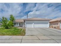 Charming single-story home with a three-car garage and well-maintained front lawn, offering curb appeal at 544 Rancho Del Sol Way, North Las Vegas, NV 89031