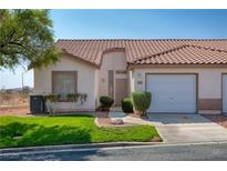 Charming single-story home featuring a tile roof, well-manicured lawn, and a one-car garage at 653 Mountain Rdg, Mesquite, NV 89027