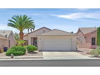 Charming single-story home features a two-car garage, desert landscaping, and a well-manicured lawn at 1991 High Mesa Dr, Henderson, NV 89012