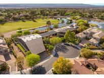 Stunning aerial view showcases an estate with a golf course, pond, and lush landscaping at 3 Anthem Pointe Ct, Henderson, NV 89052