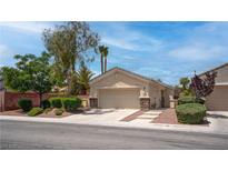 Charming single-story home featuring desert landscaping and a two-car garage at 4140 Gliding Gulls Ave, North Las Vegas, NV 89084