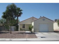 Charming single-story home with a one-car garage and desert landscaping in a sunny neighborhood at 719 Roberta Alecia Ave, North Las Vegas, NV 89031
