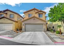 Inviting two-story home with a neutral color palette, a two-car garage and well maintained front yard at 722 Chepstow Ave, Las Vegas, NV 89178