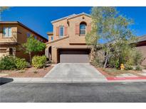 Charming two-story home features a well-maintained front yard, a two-car garage, and desert landscaping at 7613 Pulpit Rock Ct, Las Vegas, NV 89166