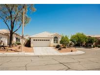 Charming single-story home with tile roof, two-car garage, and desert landscaping at 10404 Shadowland Ave, Las Vegas, NV 89144
