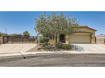 Charming single-story home with a well-maintained yard, two car garage and desert landscaping at 1197 Bear Head St, Henderson, NV 89011