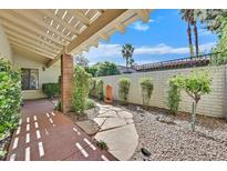 Charming front yard featuring a stone path, rock garden, and a quaint wall fountain at 1901 Calle De Espana, Las Vegas, NV 89102
