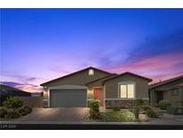 Charming single-story home with a well-manicured lawn and inviting curb appeal at 5918 Peridot Falls Ave, Las Vegas, NV 89130