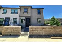 Charming townhome featuring modern architecture, a gated front yard, and a well-maintained exterior at 756 Sleeping City Ave, Henderson, NV 89015